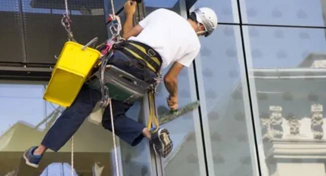 Commercial window cleaning expert cleaning exterior building glass
