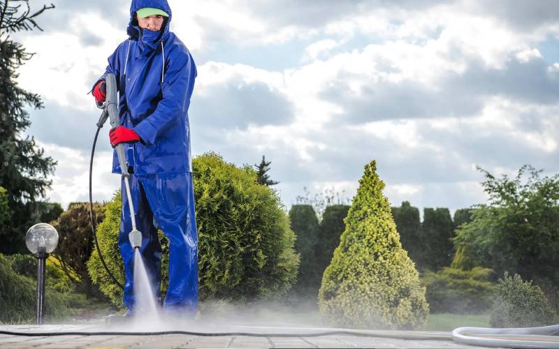 Professional commercial pressure washing service cleaning an exterior surface