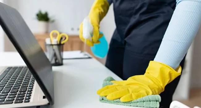 Professional commercial cleaners cleaning an office workplace